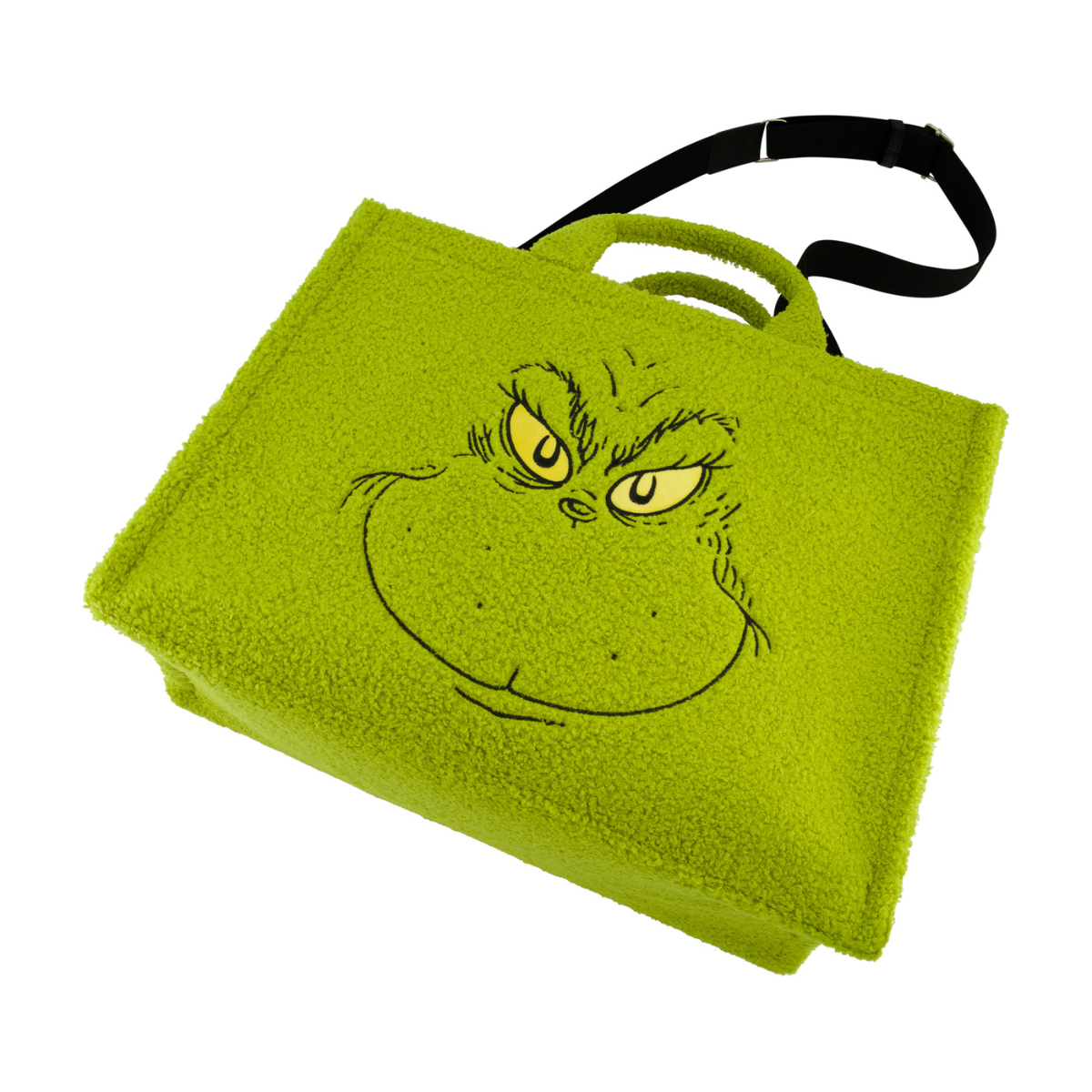 Angled Dr. Seuss green Grinch big face sherpa travel tote with trolly band and adjustable removable shoulder strap.